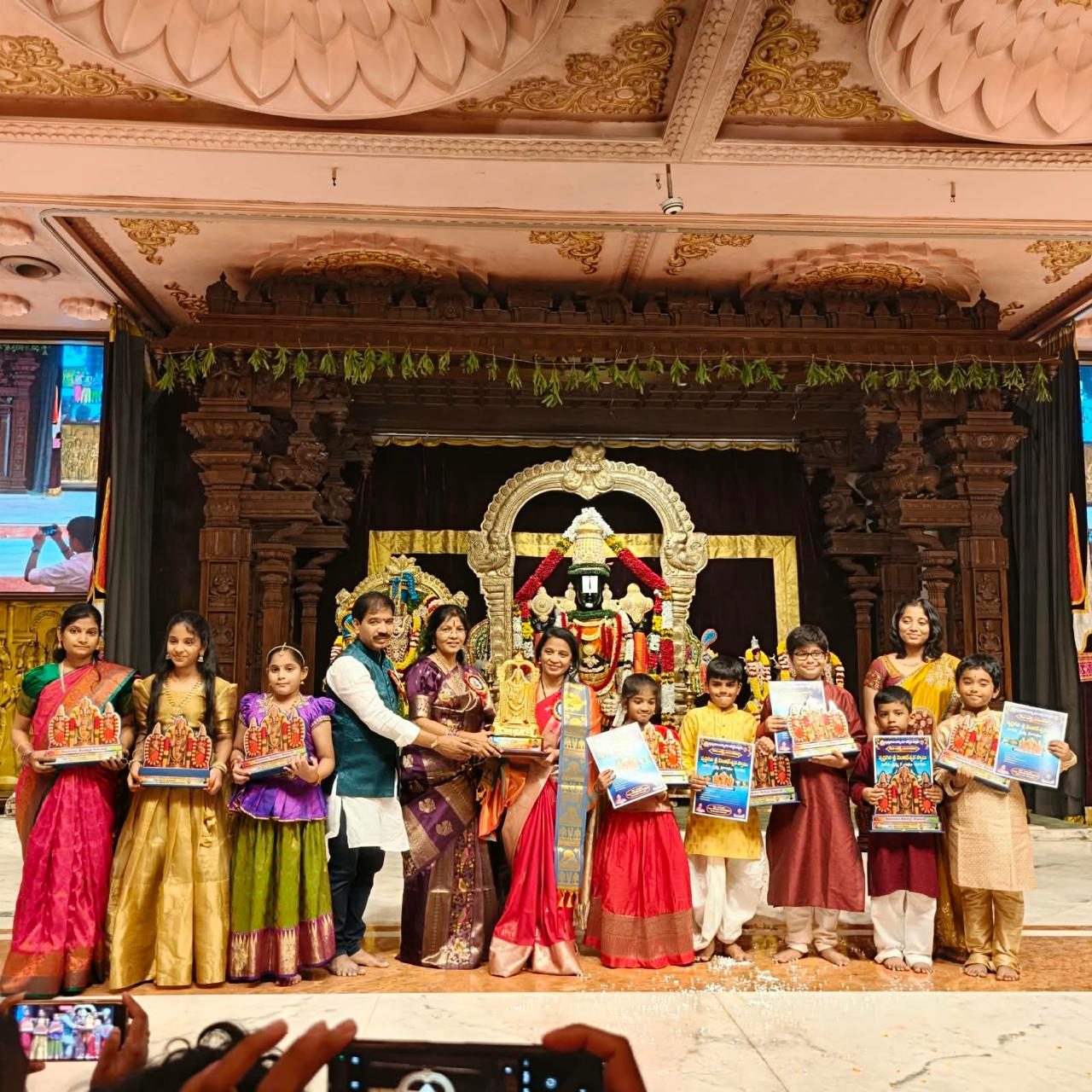 Students receiving certificates at an award ceremony