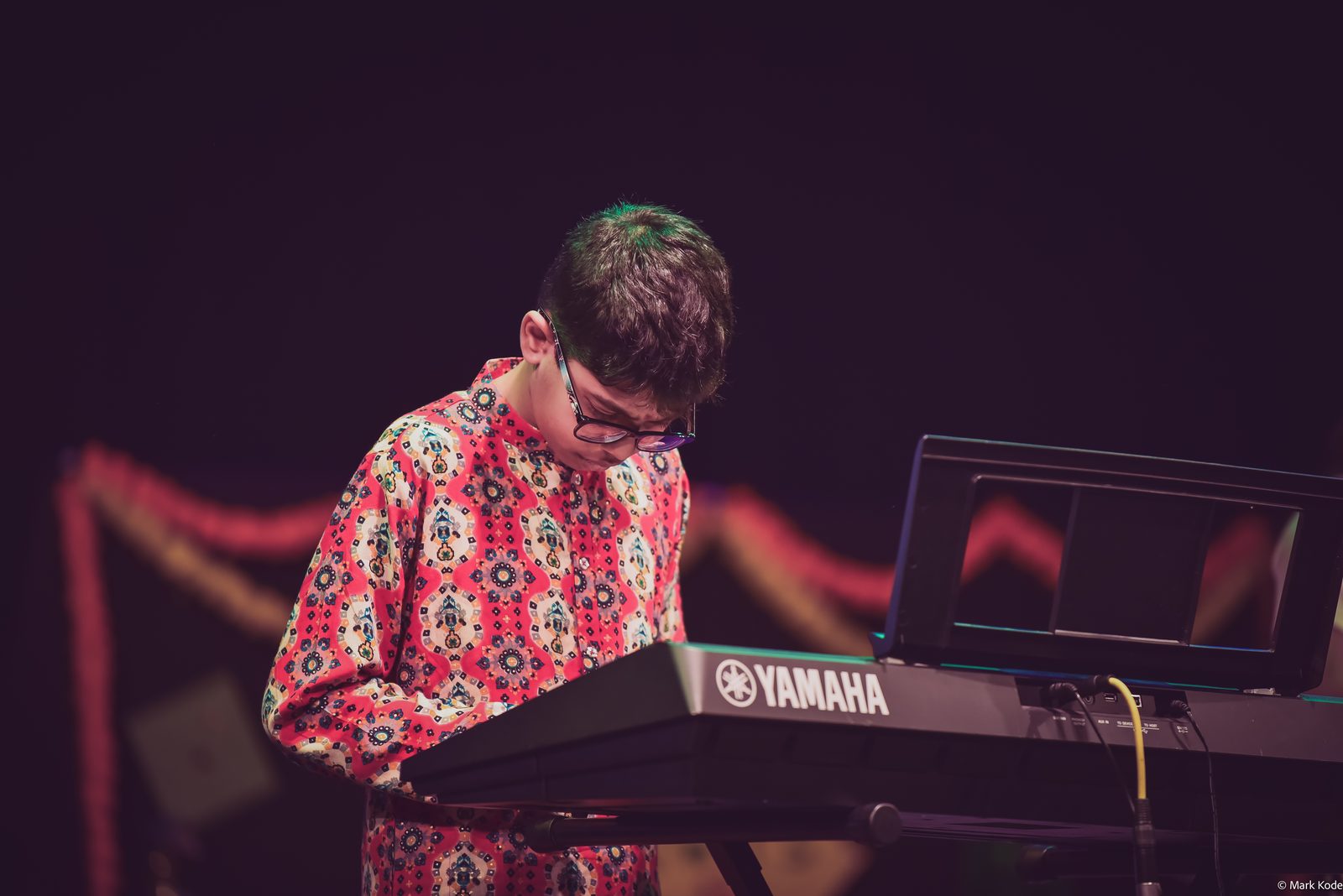 Samsruthi student performing on keyboard on stage