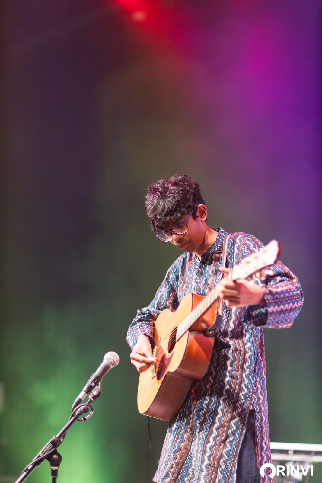 Samsruthi student performing guitar live on stage